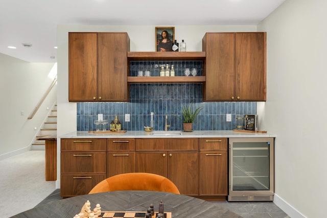 bar with beverage cooler, a sink, tasteful backsplash, indoor bar, and stairs