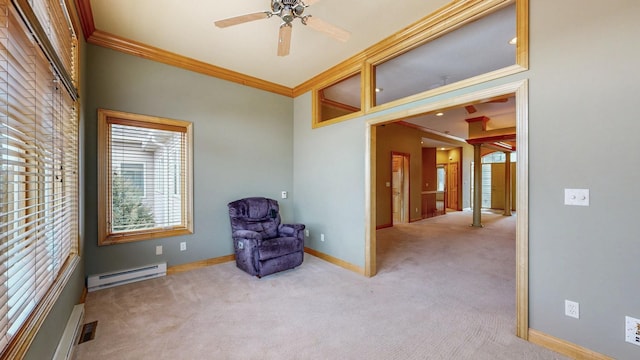 living area with baseboards, a baseboard radiator, ceiling fan, ornamental molding, and carpet flooring