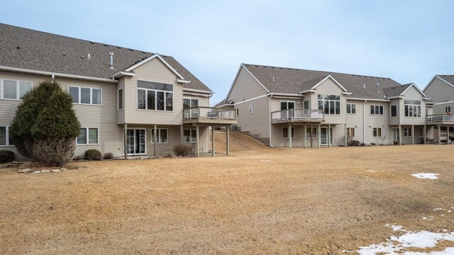 rear view of house with a wooden deck