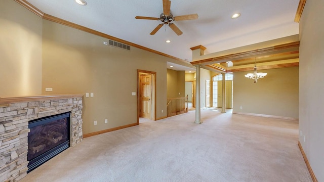 unfurnished living room featuring crown molding, baseboards, a stone fireplace, and visible vents