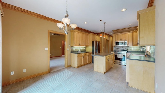 kitchen with decorative backsplash, crown molding, appliances with stainless steel finishes, dark countertops, and a sink