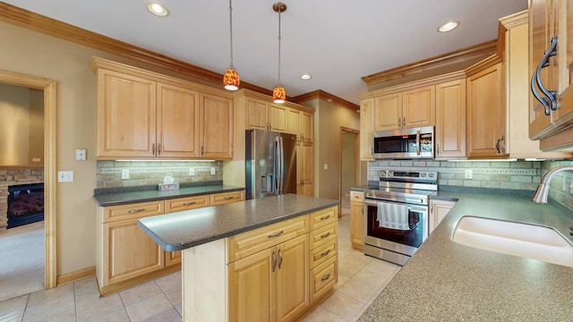 kitchen with decorative backsplash, crown molding, appliances with stainless steel finishes, light brown cabinetry, and a sink