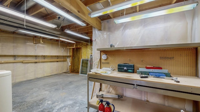 unfinished below grade area with a workshop area