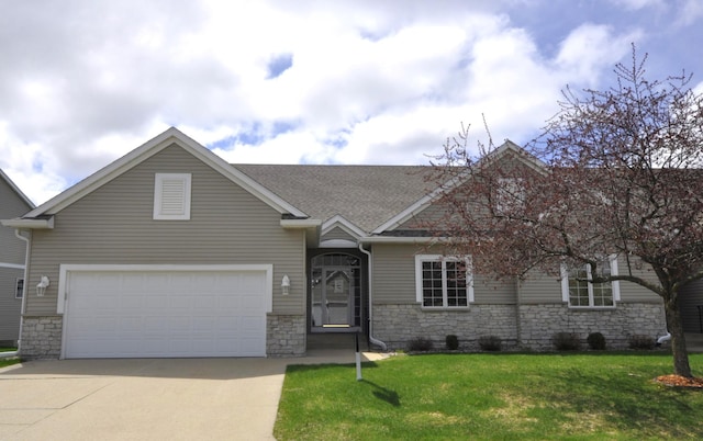 2308 Coral Ct NE, Rochester, MN 55906 - view of front of house featuring stone siding, driveway, a front lawn, a shingled roof, and an attached garage