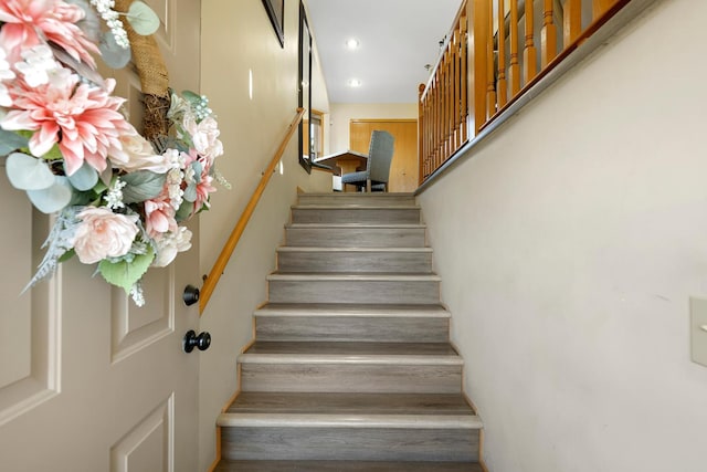 stairs featuring recessed lighting