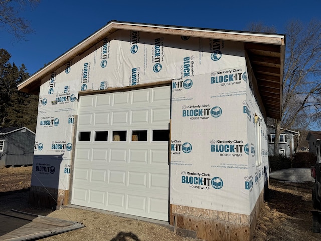 view of side of property featuring a garage