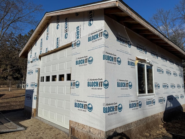 view of property exterior featuring a garage