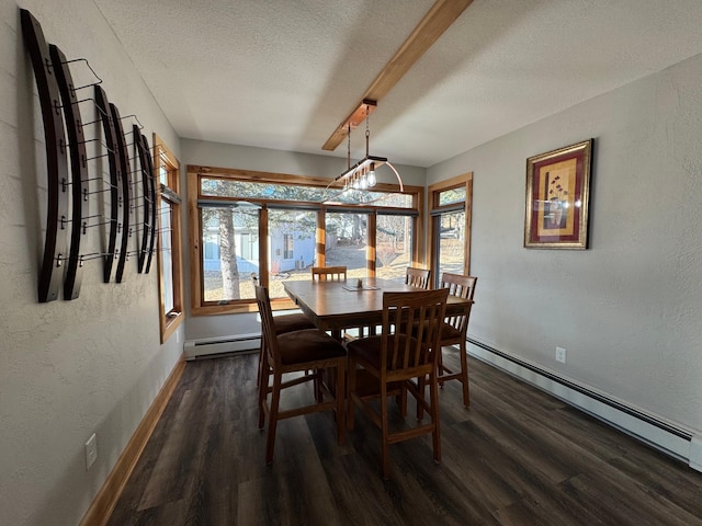 dining area with a textured ceiling, a textured wall, a baseboard heating unit, wood finished floors, and baseboards