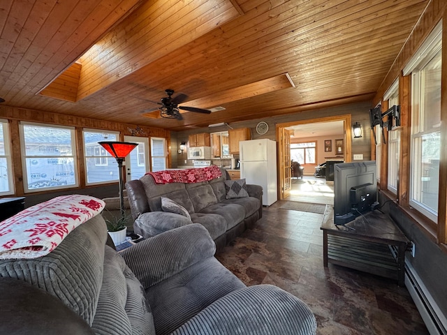 living room featuring wood ceiling, a baseboard heating unit, and a ceiling fan