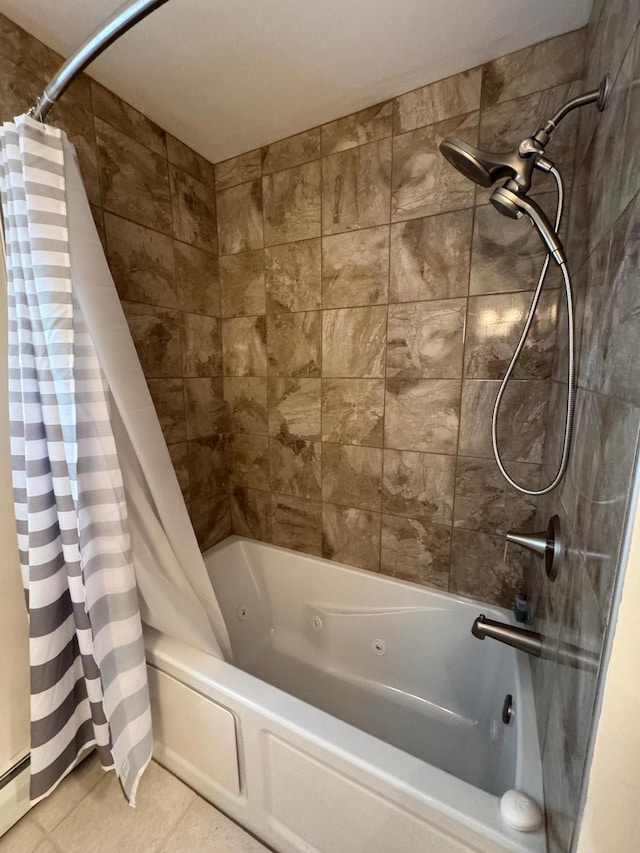 full bath with a combined bath / shower with jetted tub, a baseboard heating unit, and tile patterned floors