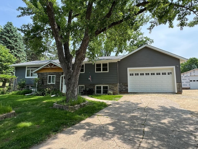 1903 Lenore Ln, Red Wing, MN 55066 - view of front of property with stone siding, driveway, an attached garage, and a front yard