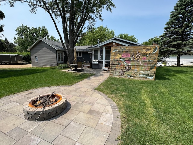 1903 Lenore Ln, Red Wing, MN 55066 - rear view of property with a fire pit, a patio, and a lawn