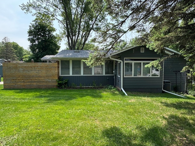 1903 Lenore Ln, Red Wing, MN 55066 - view of front facade featuring central air condition unit, a sunroom, and board and batten siding