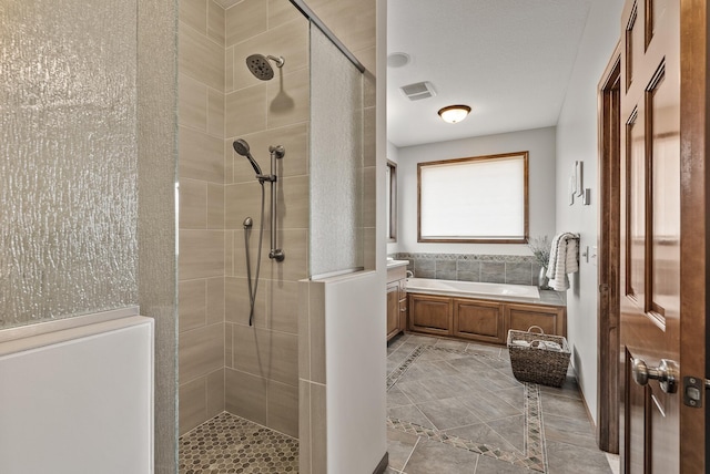 bathroom featuring a shower stall, visible vents, and a bath