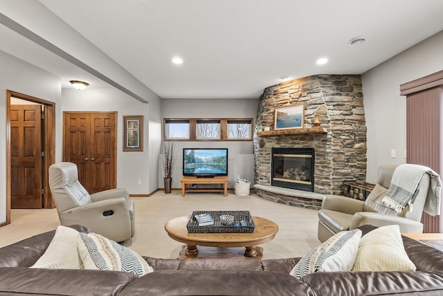 carpeted living room with recessed lighting, visible vents, baseboards, and a stone fireplace