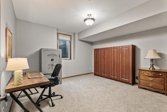 office space with light carpet and baseboards