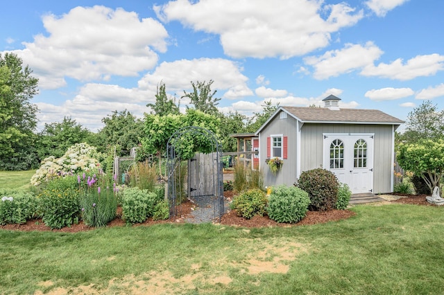 view of yard with an outdoor structure and fence