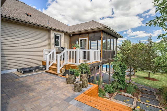 exterior space featuring a patio and a sunroom