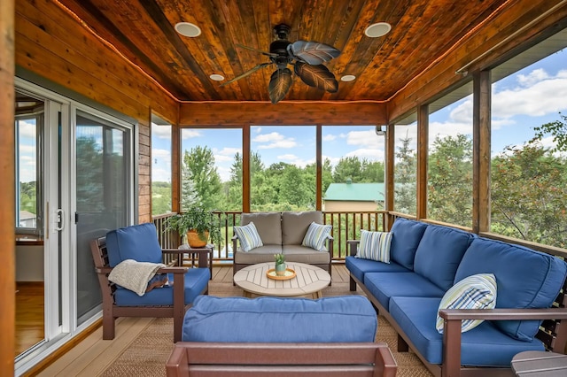 sunroom / solarium with wood ceiling and ceiling fan