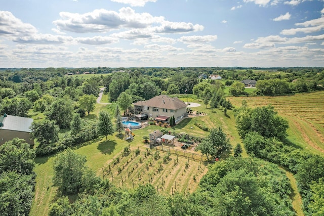 birds eye view of property with a rural view