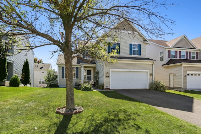 view of front of house featuring driveway, a garage, and a front lawn