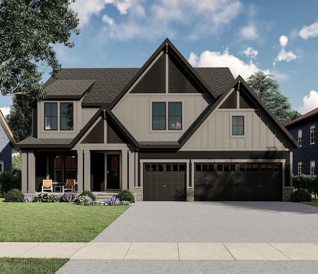 view of front facade featuring a front yard, driveway, and an attached garage