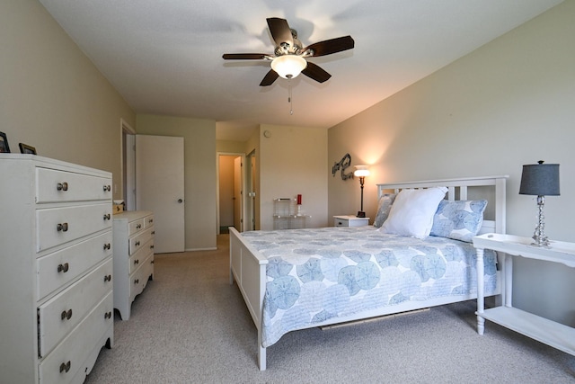 bedroom featuring a ceiling fan and light carpet