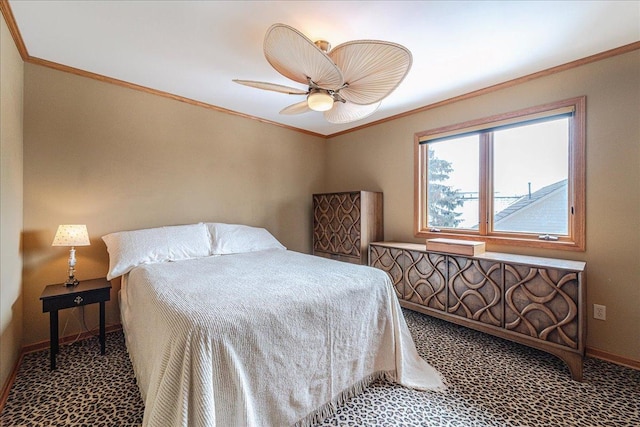 carpeted bedroom with baseboards, ornamental molding, and ceiling fan