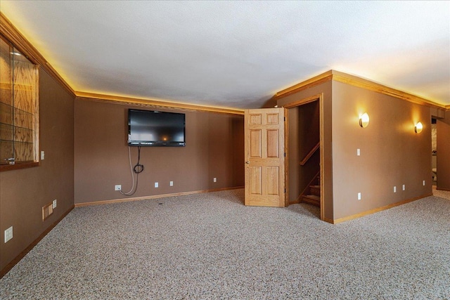 interior space featuring stairs, baseboards, and carpet flooring