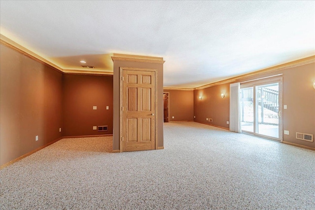 unfurnished room with baseboards, visible vents, and carpet flooring