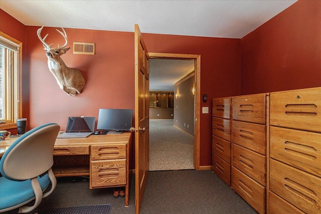 office area with dark carpet and visible vents