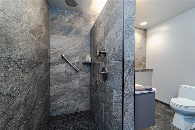 full bathroom featuring toilet, baseboards, and walk in shower