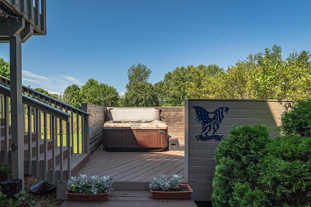 wooden terrace with a hot tub