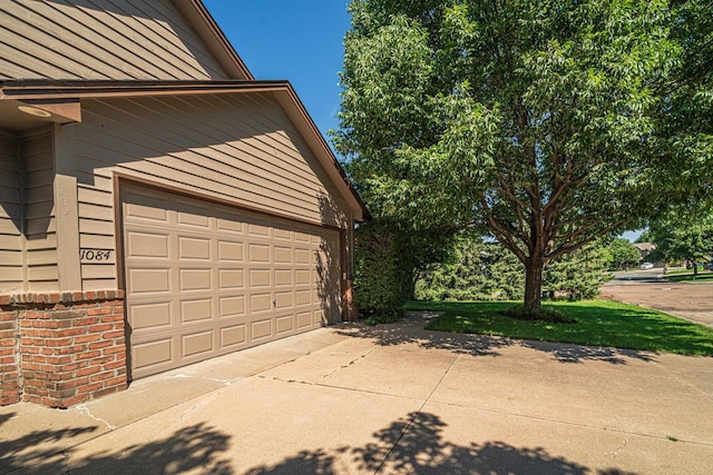 garage with concrete driveway