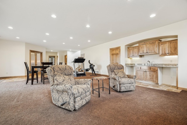 living area featuring recessed lighting, light colored carpet, visible vents, baseboards, and indoor wet bar