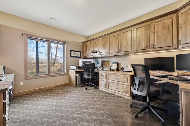 carpeted office space with baseboards