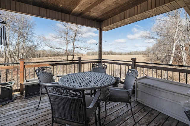 wooden terrace featuring outdoor dining space