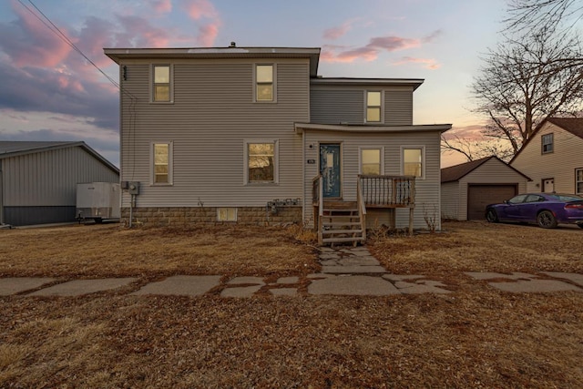 back of house with an outbuilding