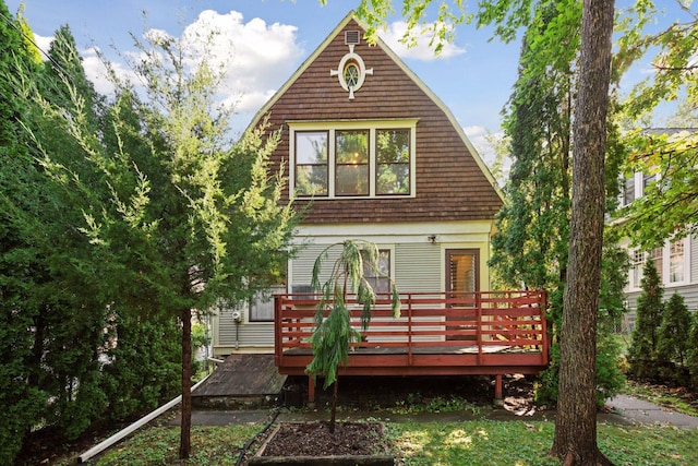 view of front facade with a wooden deck