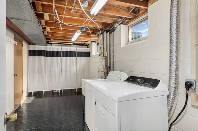 clothes washing area featuring laundry area and washer and dryer