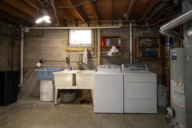 laundry area with laundry area, washer and clothes dryer, and gas water heater