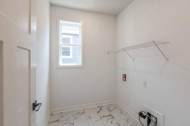 laundry room featuring marble finish floor, laundry area, hookup for a washing machine, and baseboards