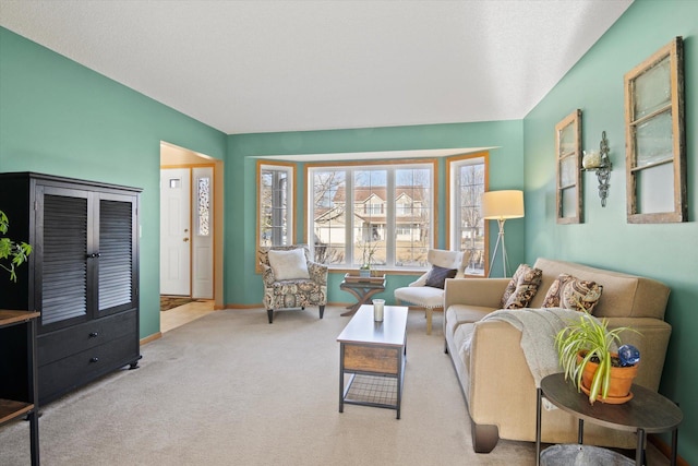 carpeted living room with baseboards