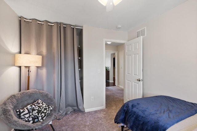 carpeted bedroom with baseboards and visible vents