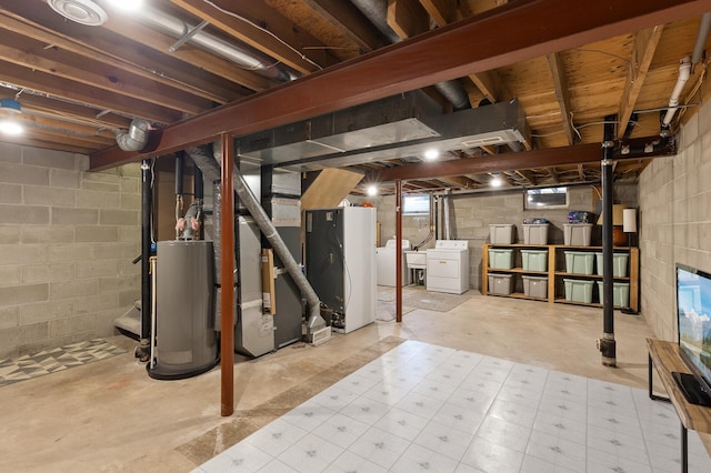 unfinished below grade area with washing machine and dryer, water heater, and heating unit