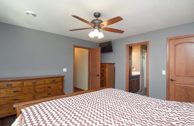 bedroom with ceiling fan and ensuite bathroom