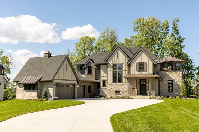 view of front facade featuring an attached garage, concrete driveway, board and batten siding, a front lawn, and a standing seam roof