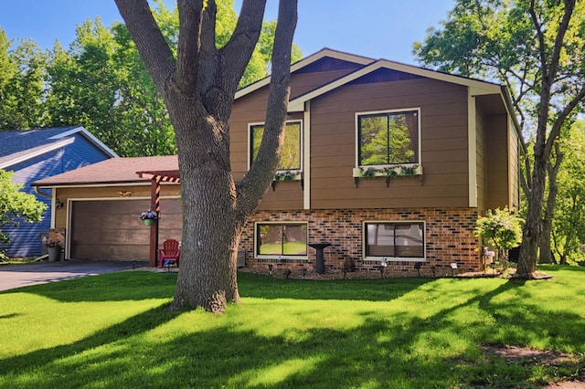 view of front of home featuring a front yard, a garage, brick siding, and concrete driveway