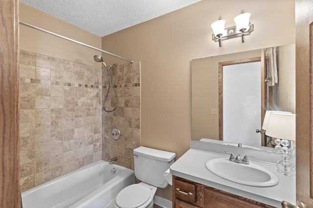 bathroom featuring vanity,  shower combination, toilet, and a textured ceiling