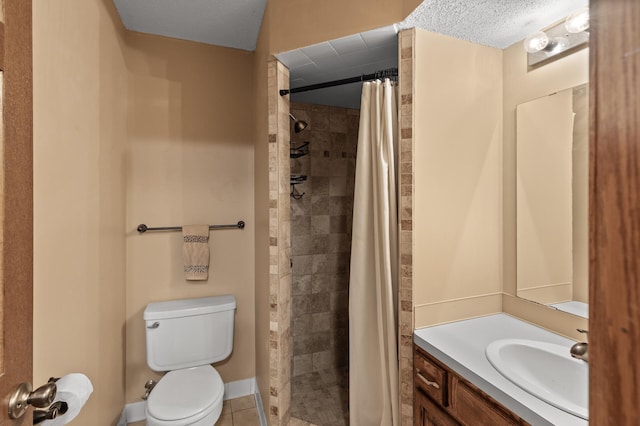 full bathroom with tile patterned floors, toilet, vanity, and a tile shower